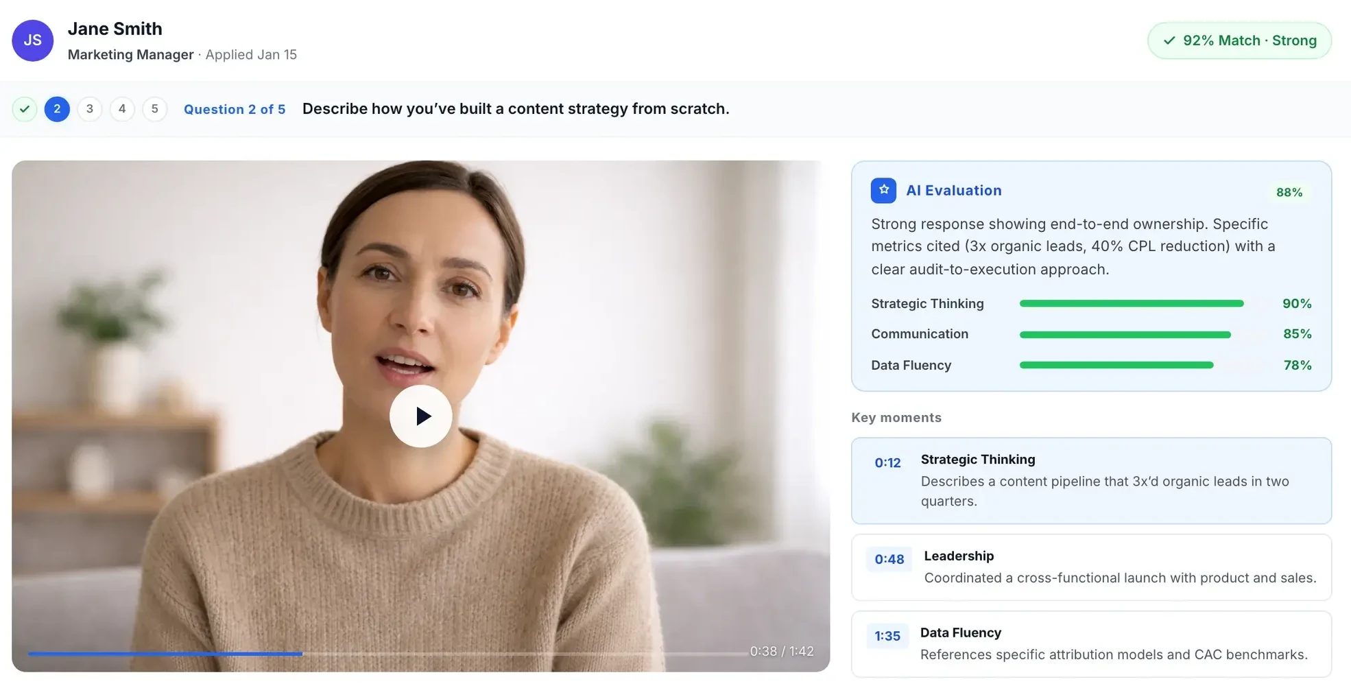 Truffle one-way interview review: the candidate's video answer next to an AI evaluation with scores and key moments.